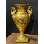 A 19th century Paris porcelain two handled pedestal vase, painted en-grisaille with musical trophies