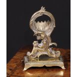 A 19th century brass pocket watch stand, cast in the Rococo taste with a figure reading, 17cm