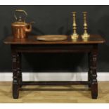 A 17th century and later joined oak table, of small proportions, rounded rectangular top, turned