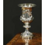 An early Victorian silver campana goblet, of military interest, chased with a hare coursing scene,