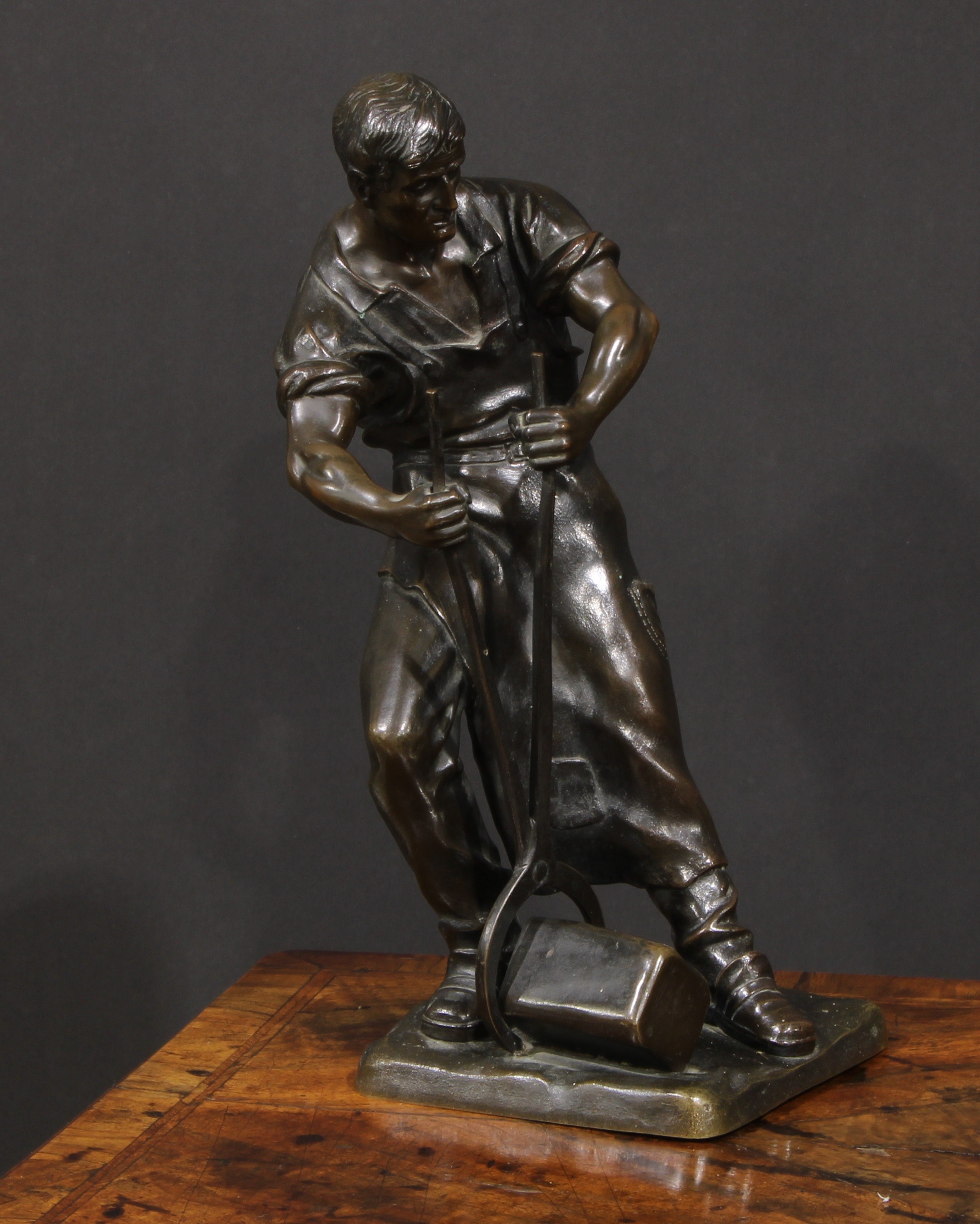 Otto Schmidt-Hofer (German, 1873–1925), a dark patinated bronze figure, Blacksmith, 37cm high