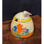 A Clarice Cliff Bizarre Blue Crocus pattern ribbed honey pot and cover, the moulded basketweave