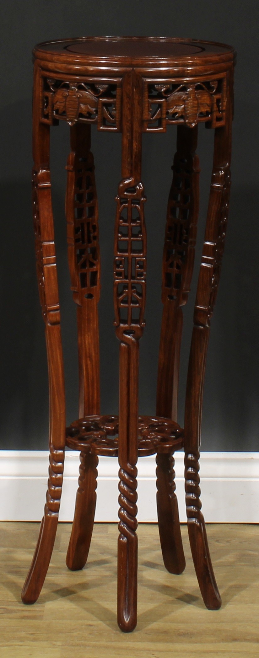 A Chinese hardwood jardiniere stand, circular top, shaped apron pierced and carved with moths, - Image 2 of 6