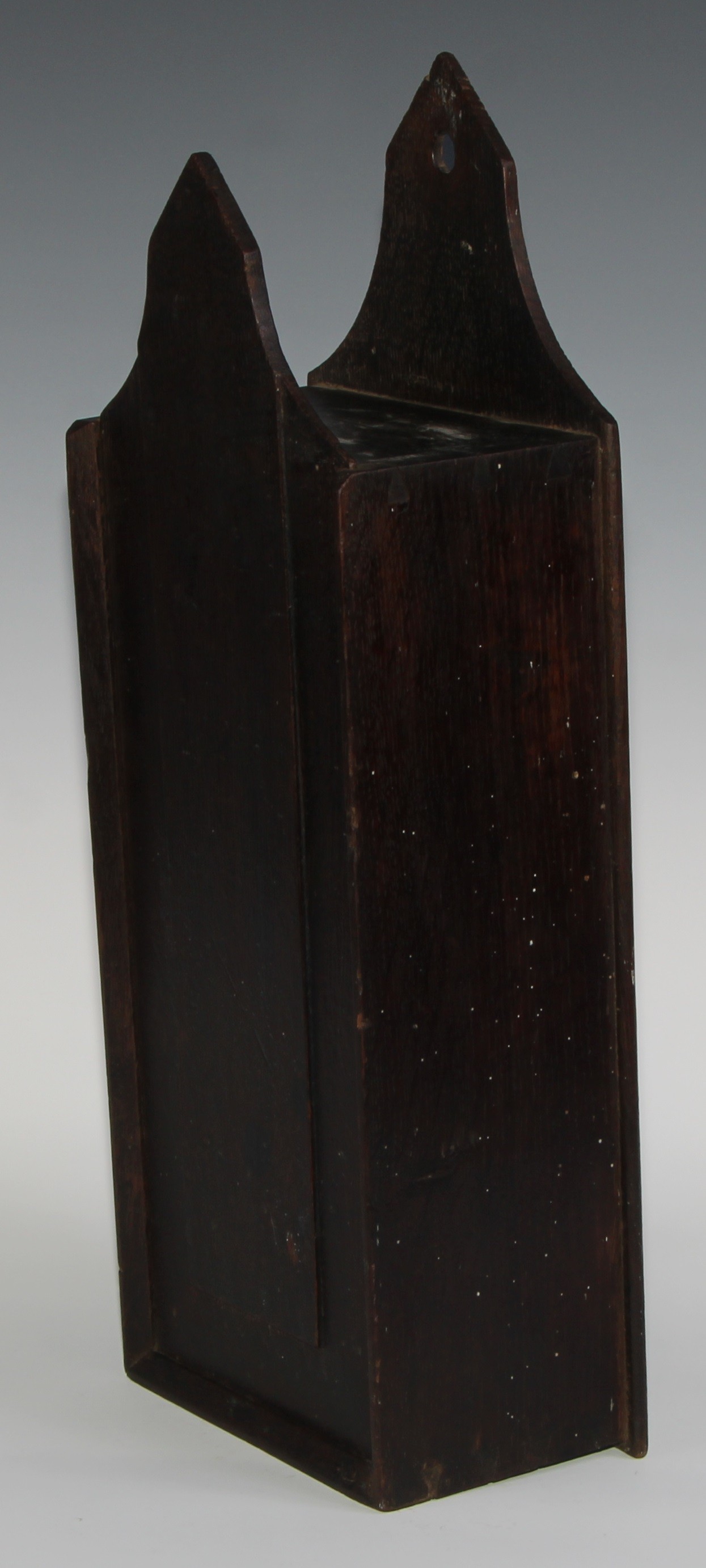 A George III oak candle box, possibly Welsh, pointed arched cresting, raised panelled sliding cover, - Image 4 of 4