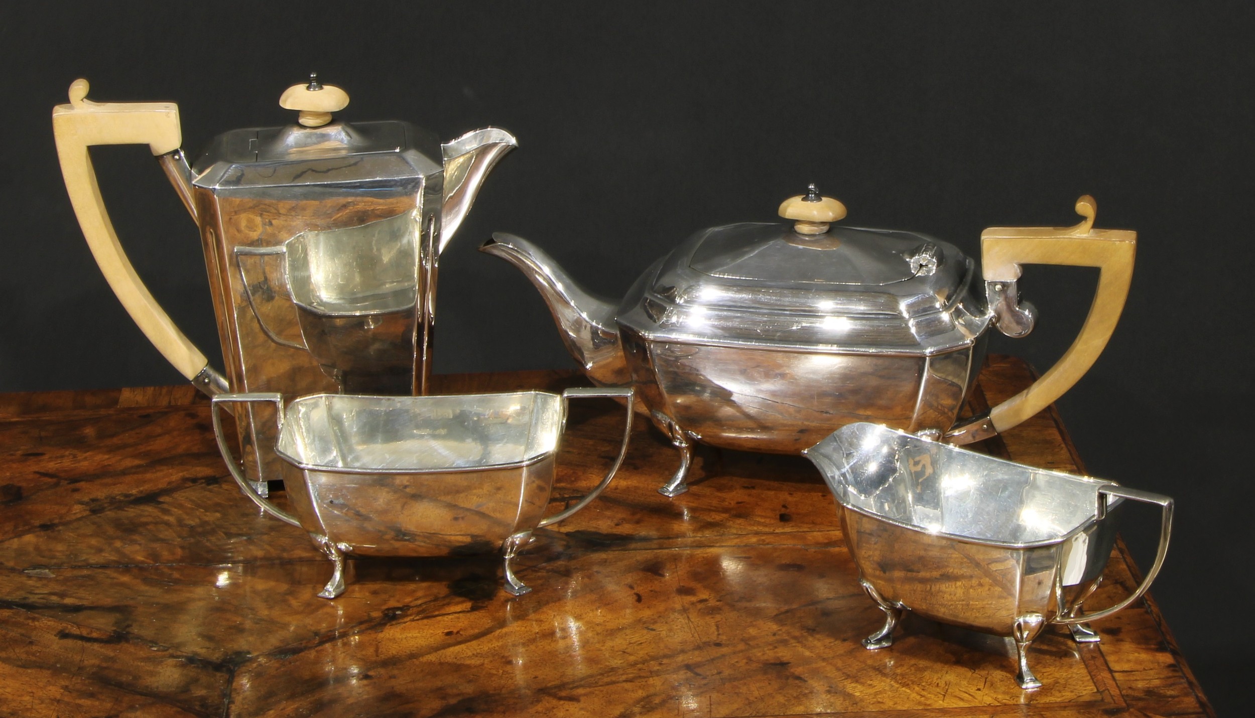 A George V Art silver Art Deco four piece tea service, angular handles, pad feet, Cooper