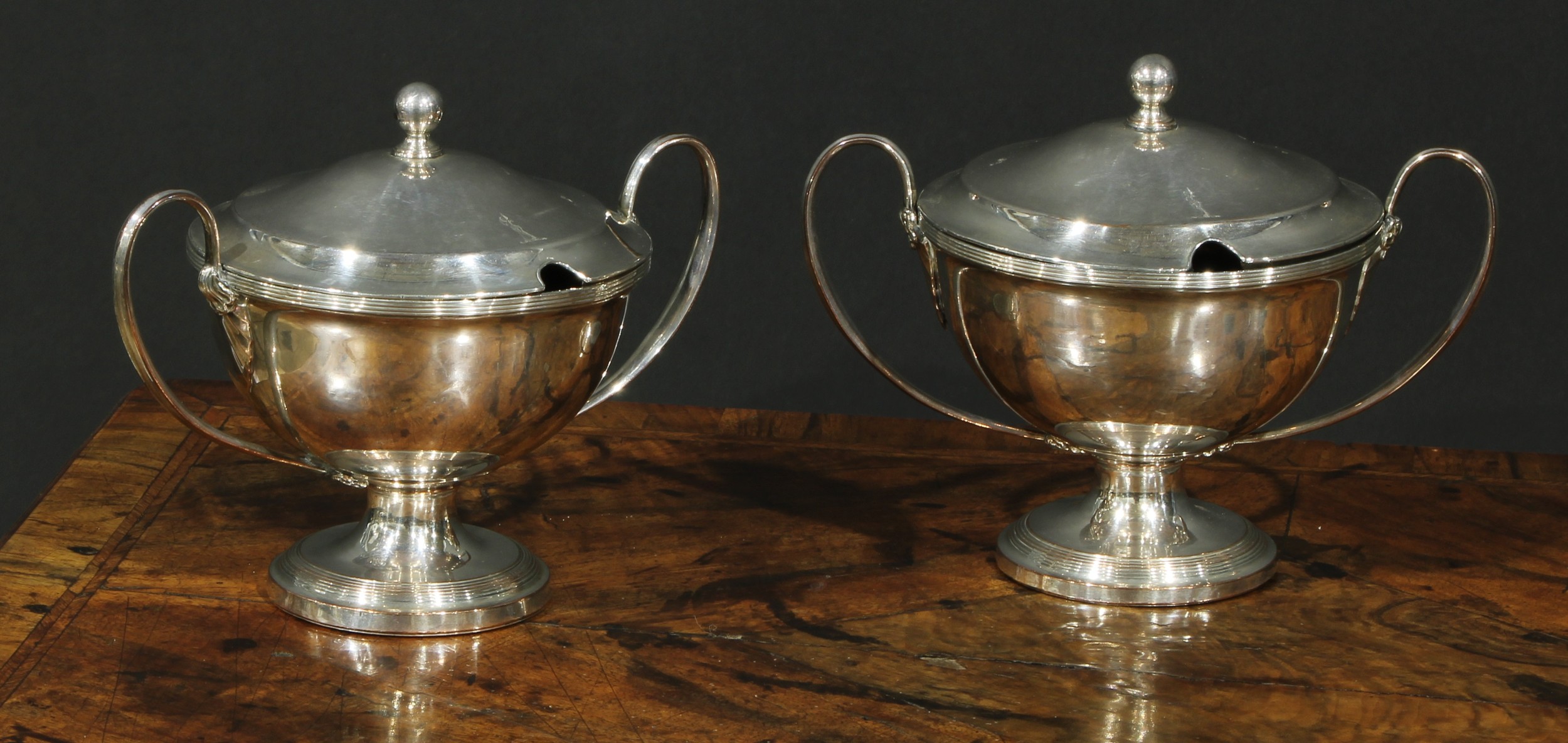 A pair of George III Old Sheffield Plate circular pedestal sauce tureens and covders, ball