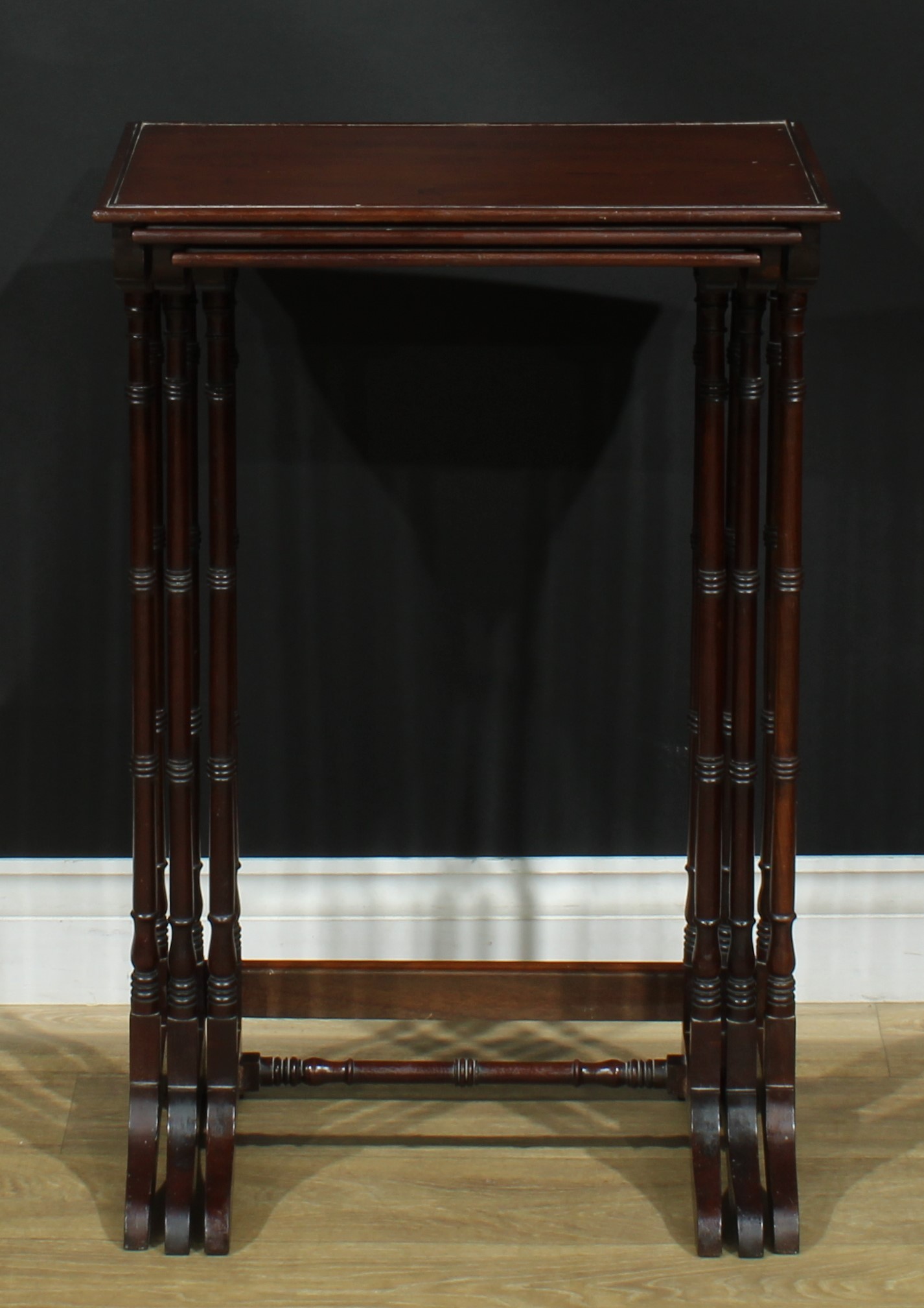 A nest of three George III Revival mahogany occasional tables, each with a rectangular top, turned - Image 2 of 5