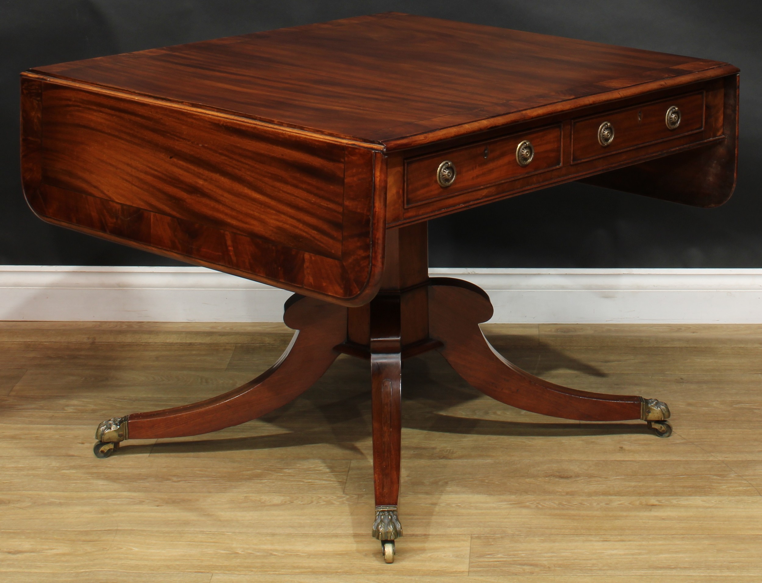 A Regency flame crossbanded mahogany sofa table, rounded rectangular top with fall leaves above a - Image 4 of 7