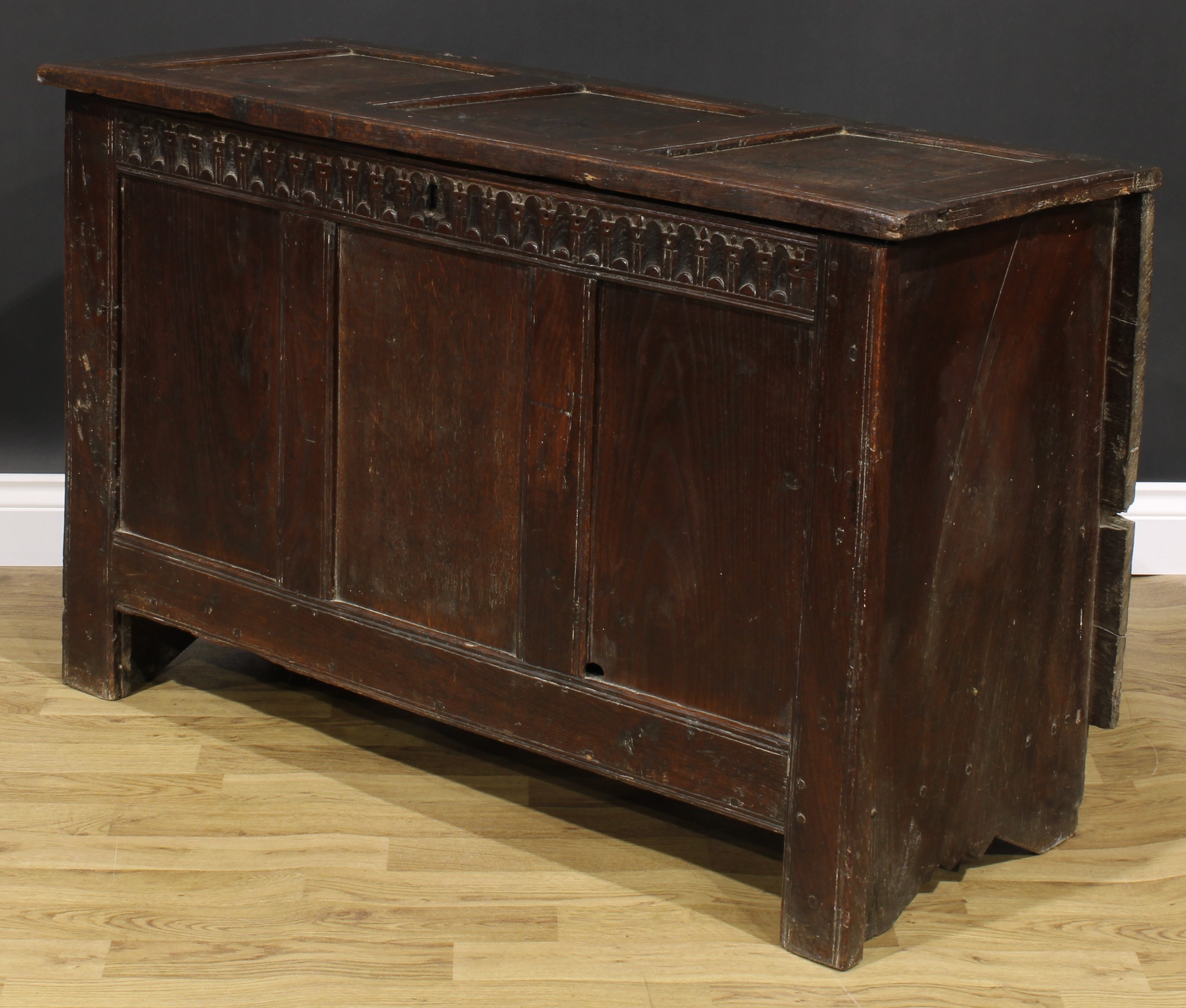 A 17th century oak blanket chest, hinged top, nulled frieze, three panel front, 74cm high, 115cm - Image 4 of 5