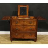A 19th century Dutch mahogany dressing chest, tripartite hinged top, the centre enclosing a