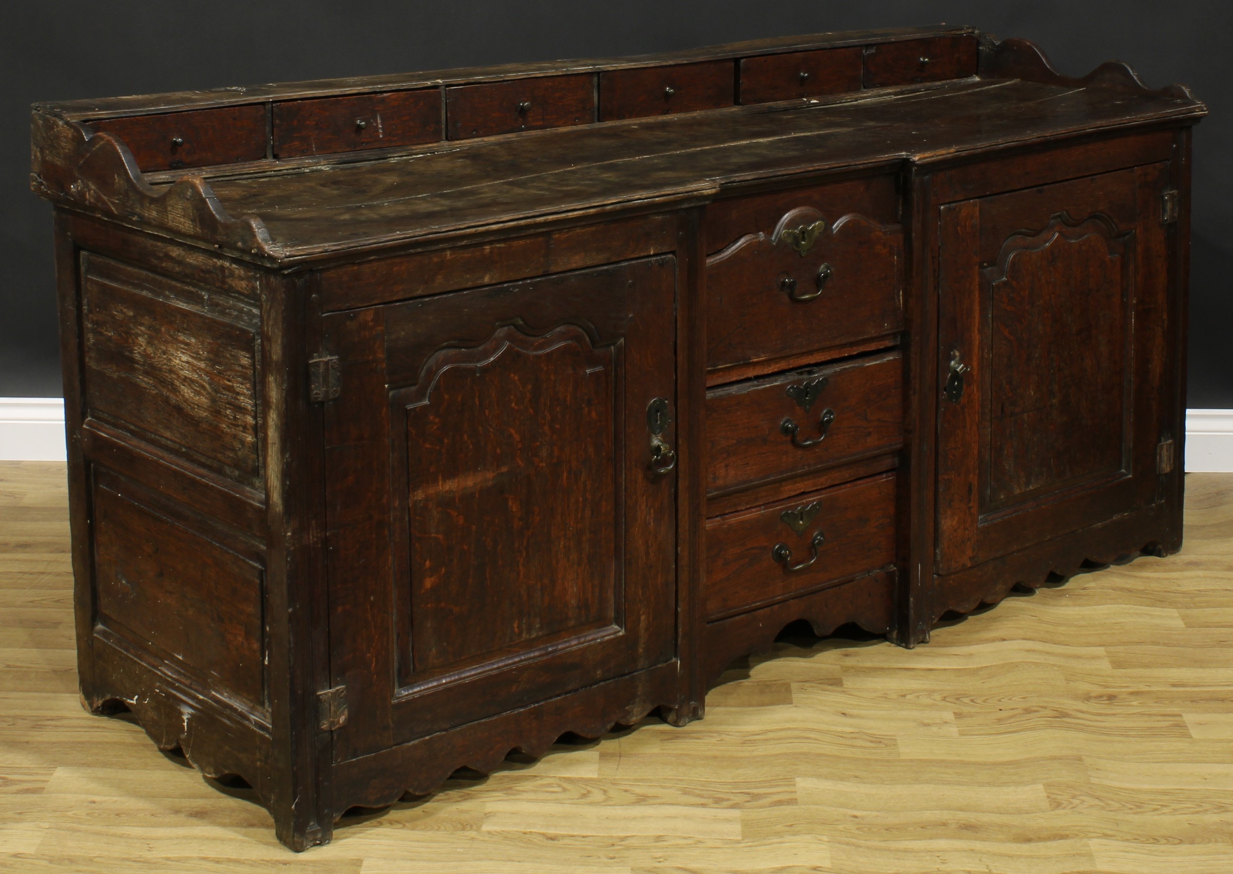 An 18th century oak low dresser, rectangular top with six small drawers above a pair of raised and - Image 4 of 6