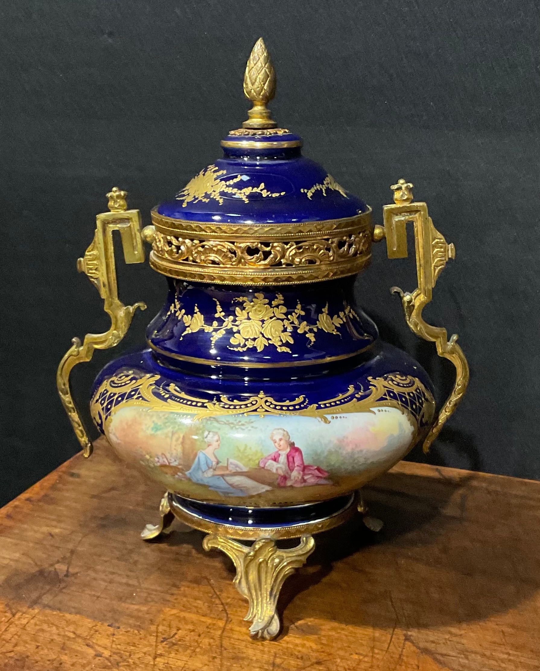 A French porcelain gilt-metal mounted ovoid potpourri vase and cover, in the Louis XVI taste,