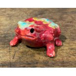 A Bernard Moore flambé model, of a toad, speckled with tones of orange and turquoise, 5.5cm long,