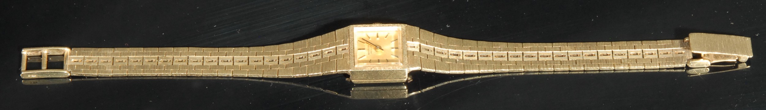 A 9ct gold Marvin Revue ladies wristwatch, square champagne dial, baton hour markers, articulated - Image 3 of 3