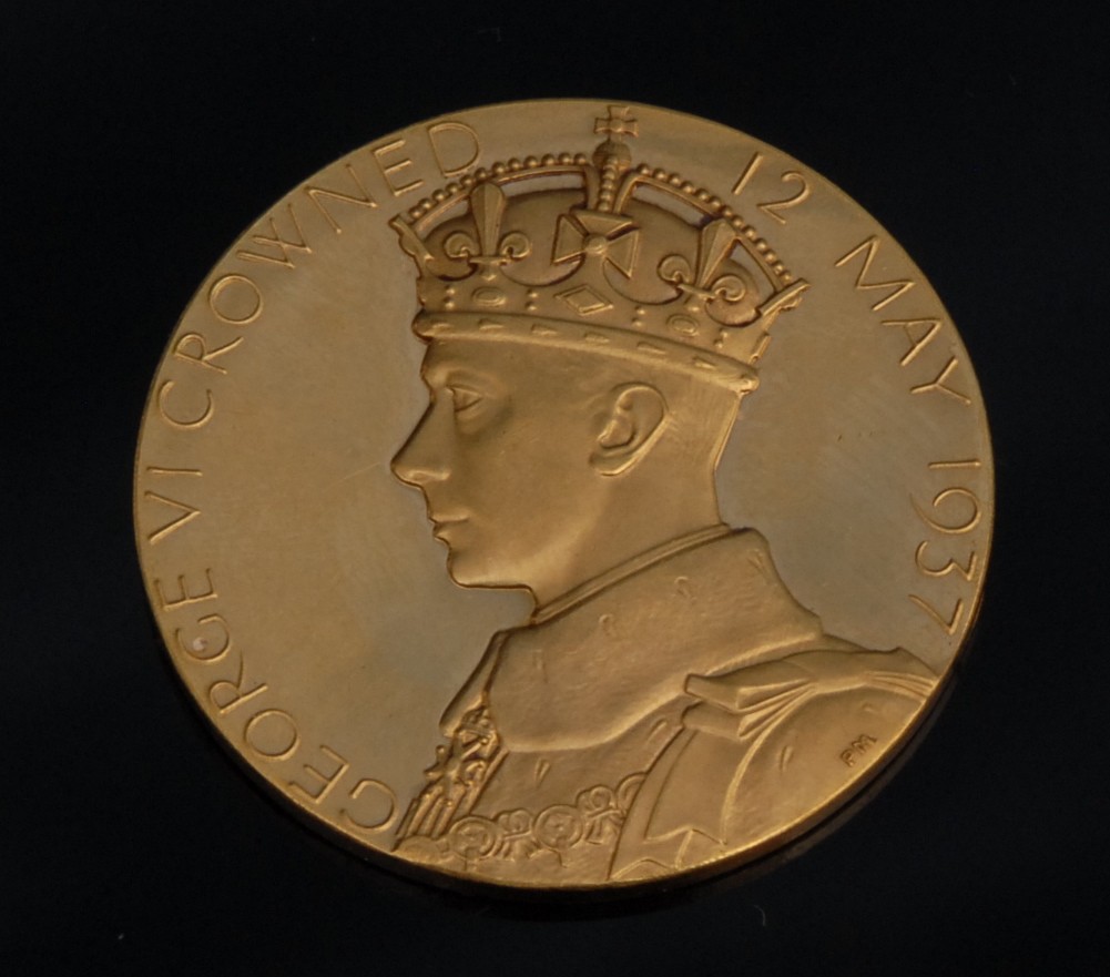 A gold coin to commemorate the Coronation of George VI, designed by Percy Metcalfe, obverse bust