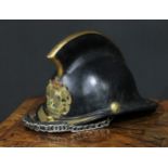 Fire Brigade History - a leather and brass fireman's helmet, applied with the German arms of Bayern,