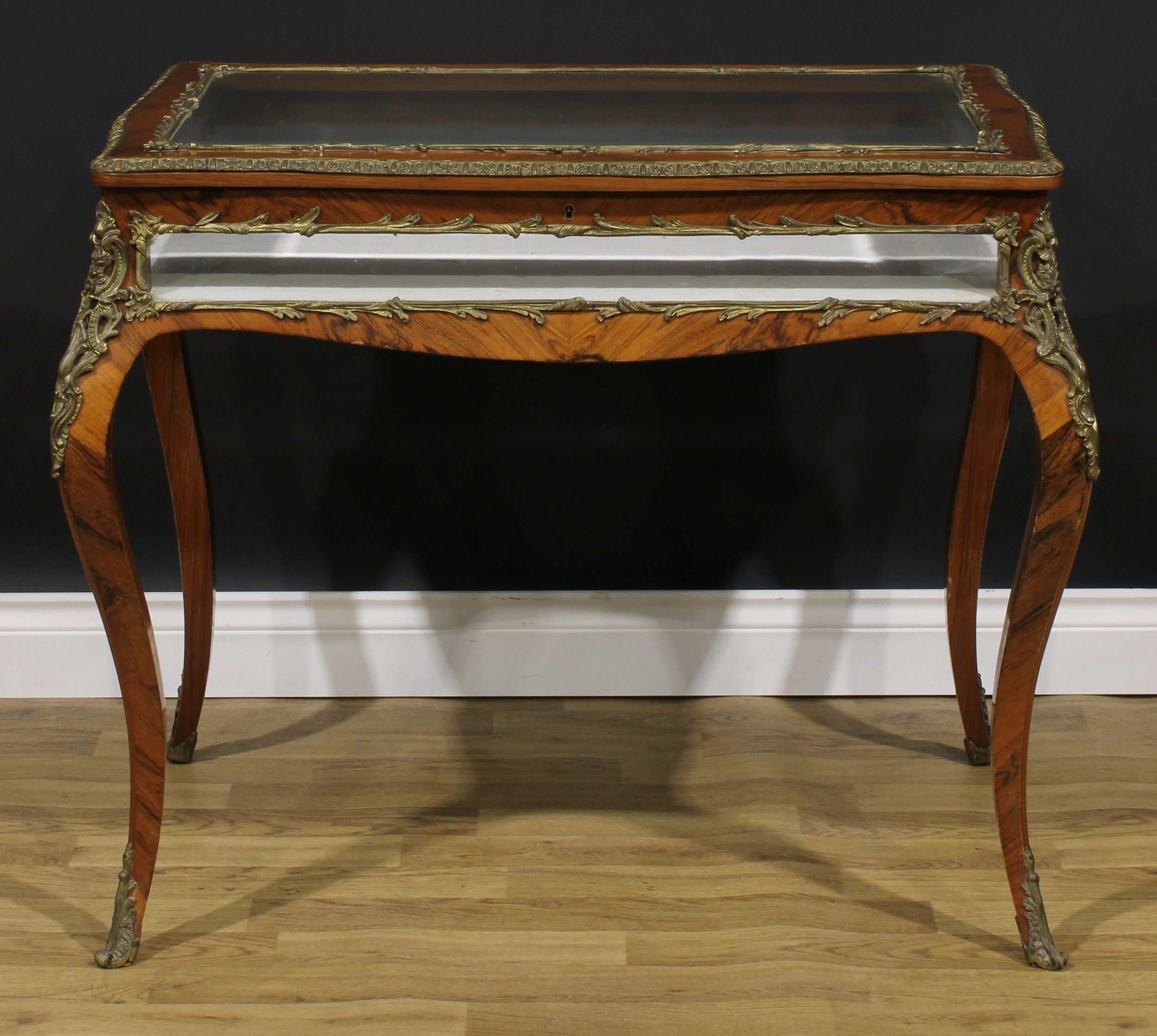 A Louis XV Revival gilt metal mounted rosewood bijouterie table, hinged top, French cabriole legs,