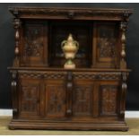 A 17th century style oak duodarn, moulded cornice above a pair of doors centred by a panel, carved