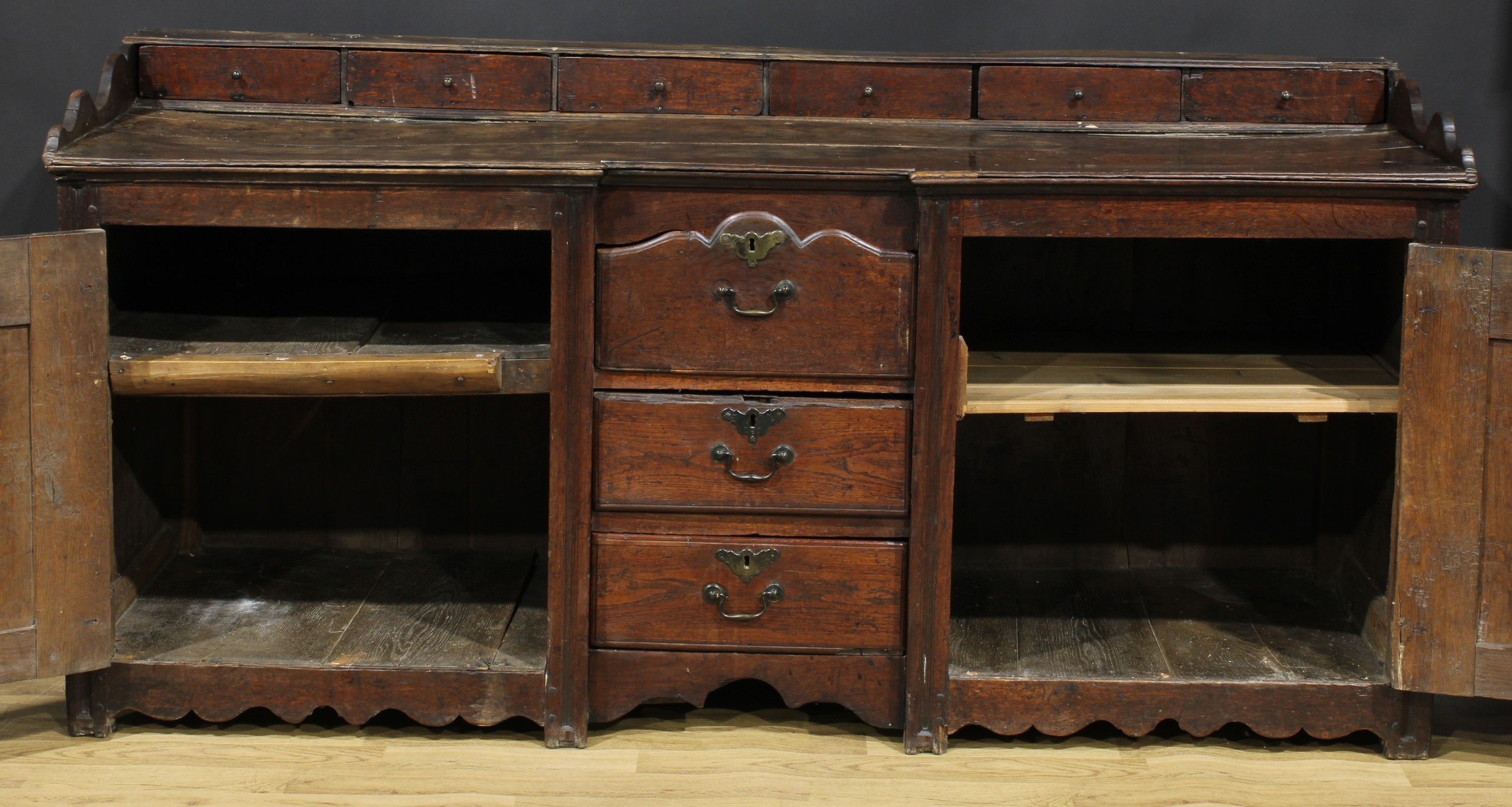 An 18th century oak low dresser, rectangular top with six small drawers above a pair of raised and - Image 3 of 6