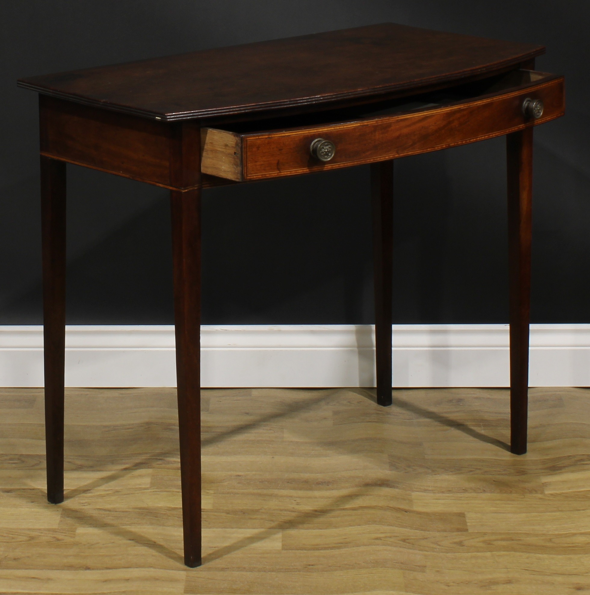 A George III mahogany bowfront side table, oversailing top with reeded edge above a long satinwood - Image 4 of 6