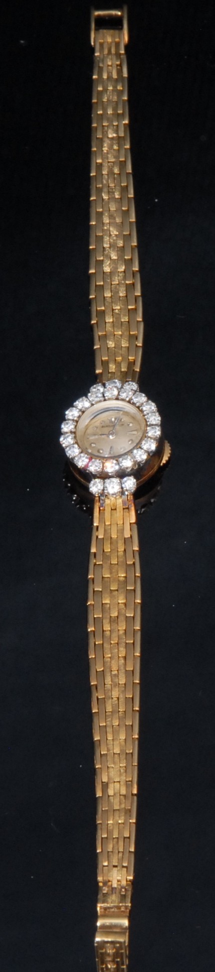 A ladies diamond set 18ct gold Jaeger-LeCoultre cocktail watch, champagne dial, baton hour