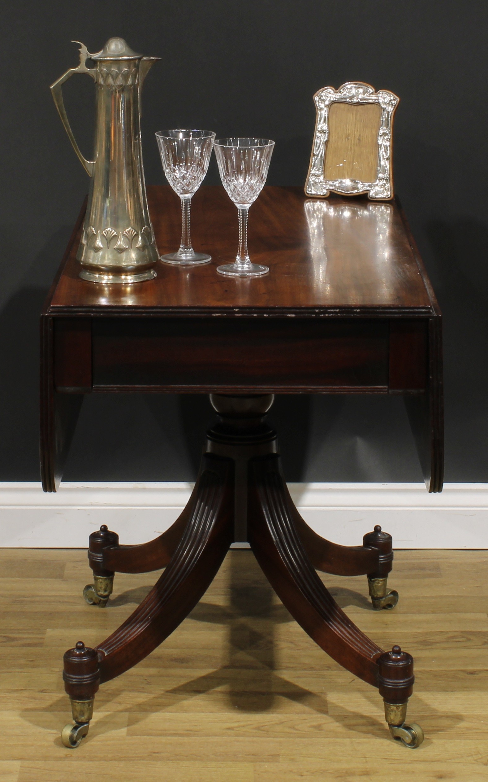 A George IV mahogany Pembroke table, possibly Scottish, rounded rectangular top with reeded edge and