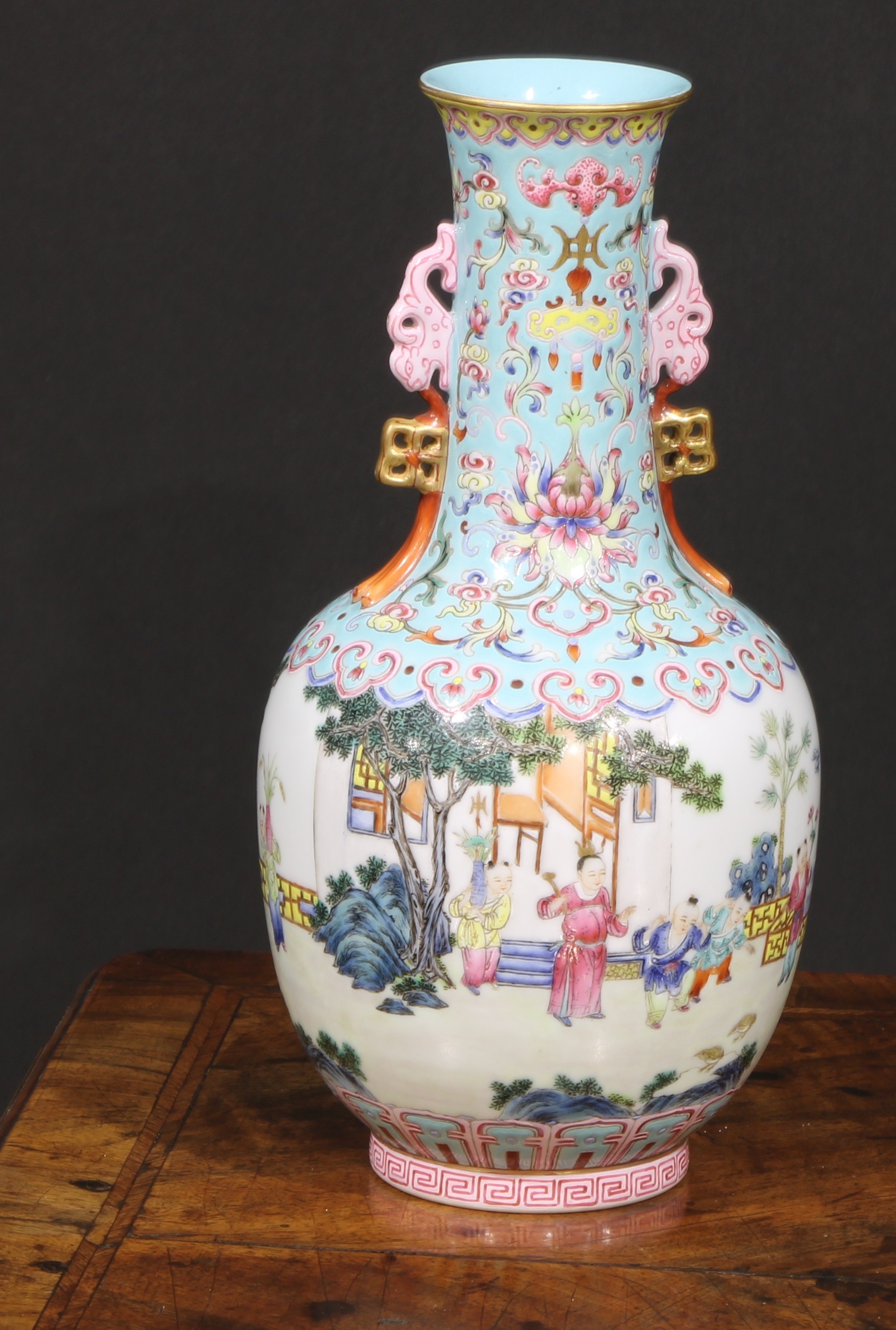 A Chinese ovoid ovoid vase, painted in polychrome enamels with children at play outside a pagoda,