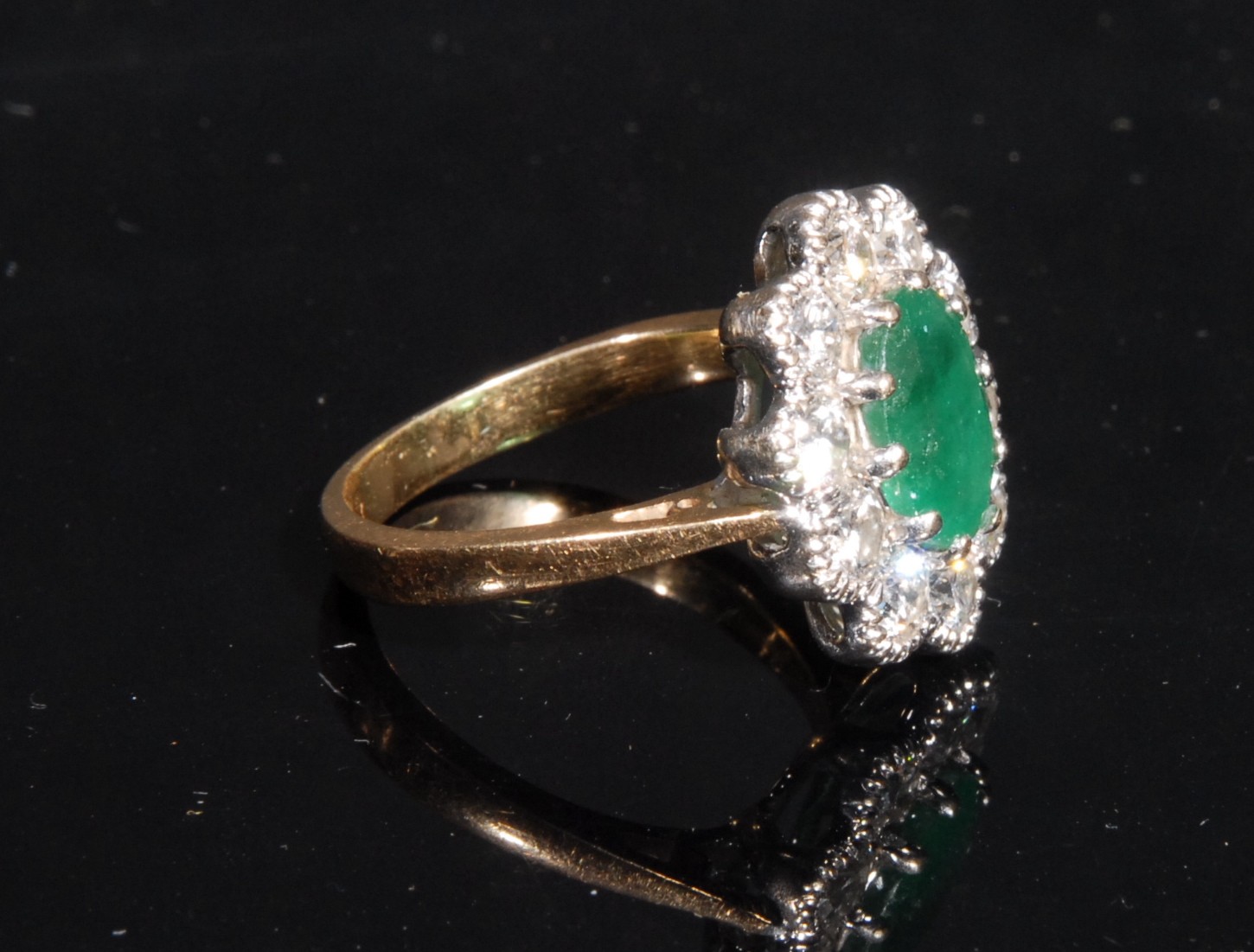 A diamond and emerald cluster ring, the central oval facet cut raised claw set emerald within 10 - Image 2 of 2