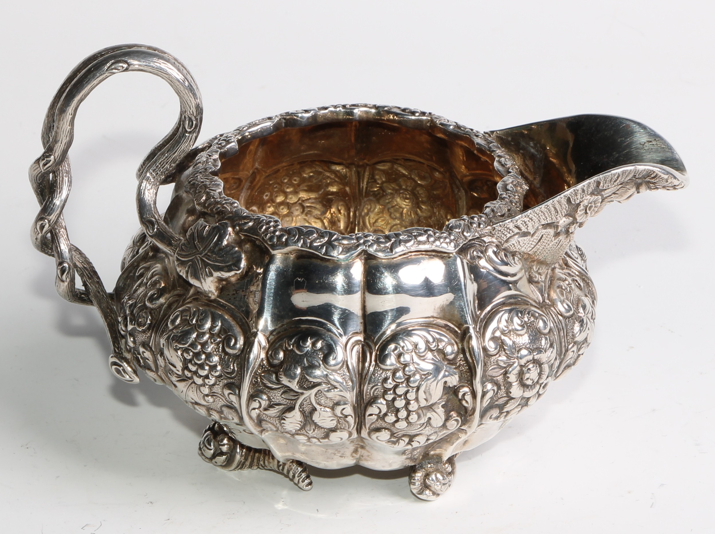 A George IV silver three piece melon shaped tea service, comprising teapot, milk jug and sugar - Image 8 of 14