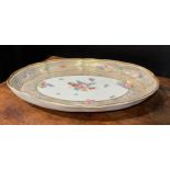 A rare Bristol shaped oval cabaret tray, the central field painted with floral spray, with further