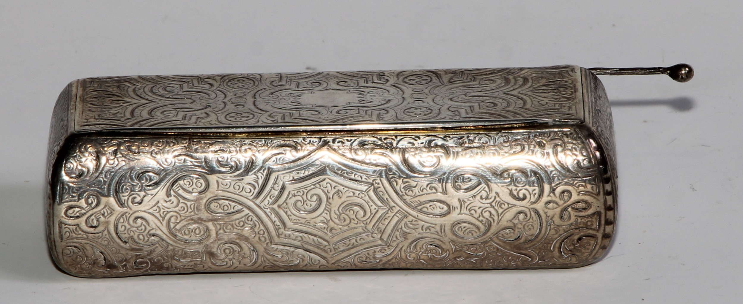 A 19th century French bowed rectangular snuff box, engraved and chased overall with strap work and - Image 2 of 5