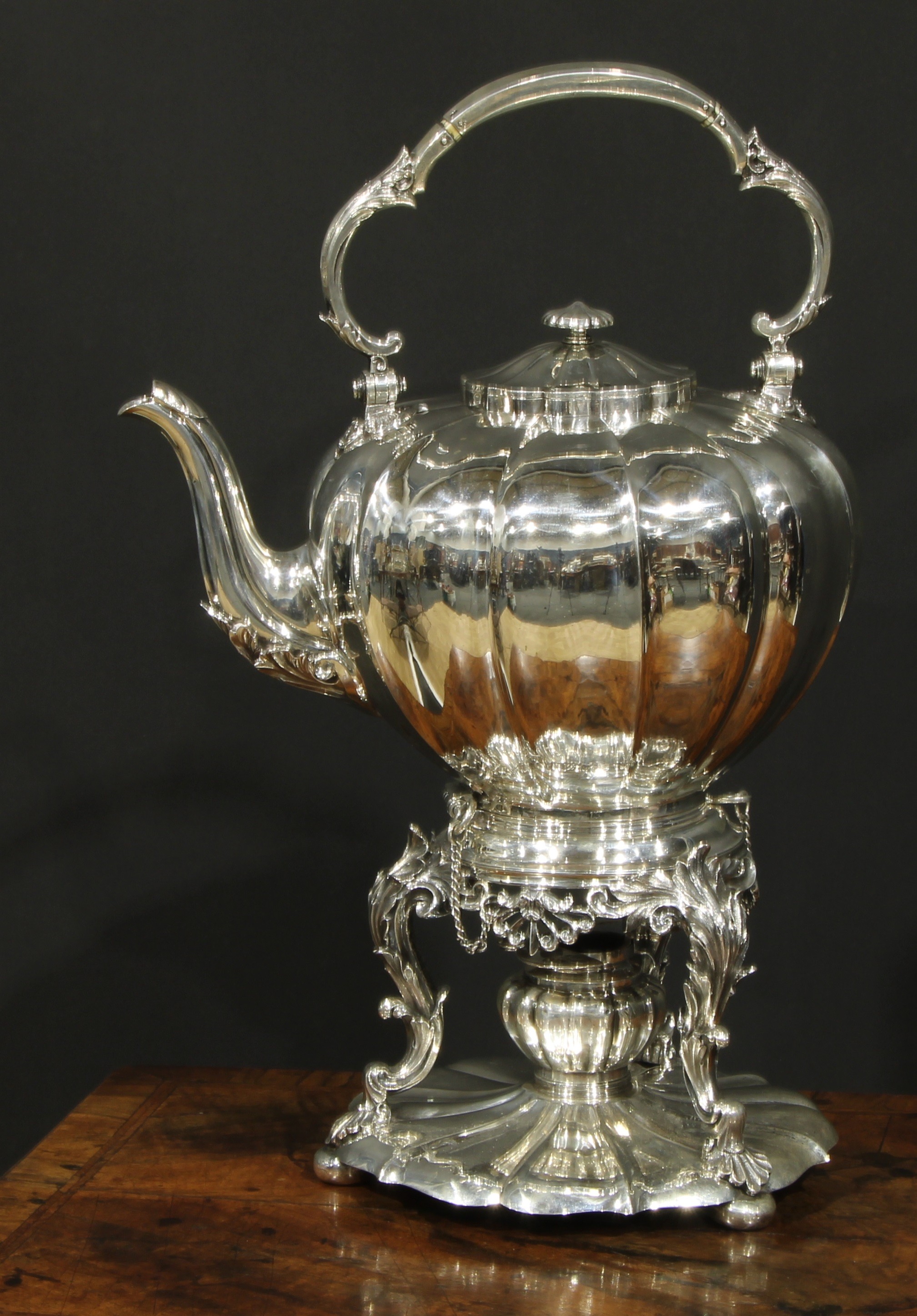 A large early Victorian Rococo Revival silver melon shaped tea kettle, stand and burner, swing