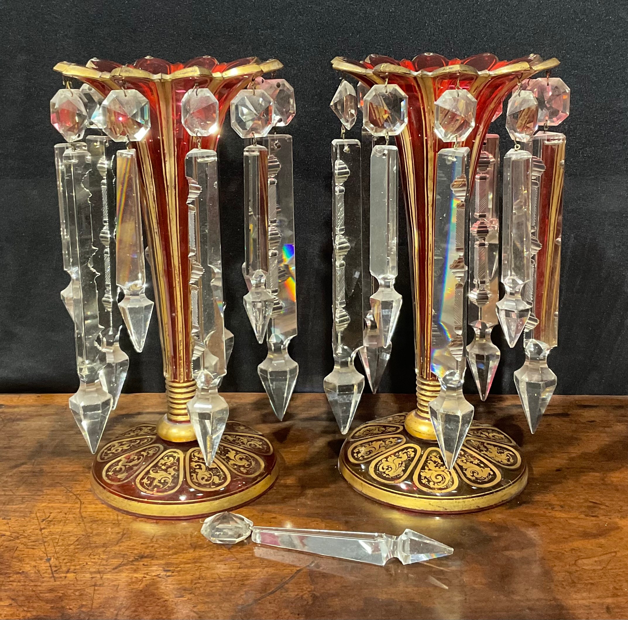 A pair of 19th century Bohemian ruby flashed and gilt table lustres, of trumpet form with shaped cut