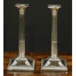 A pair of George III Old Sheffield Plate stop-fluted Corinthian column candlesticks, beaded nozzles,