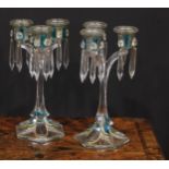 A pair of 19th century pressed glass three-light candle lustres, with blue-flash panels picked out