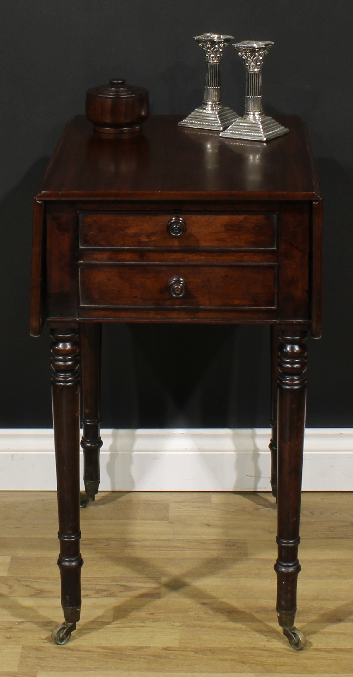 A George IV mahogany Pembroke occasional table, rounded rectangular top with fall leaves above a