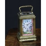 A French porcelain mounted gilt brass miniature carriage timepiece, 3cm clock dial decorated with
