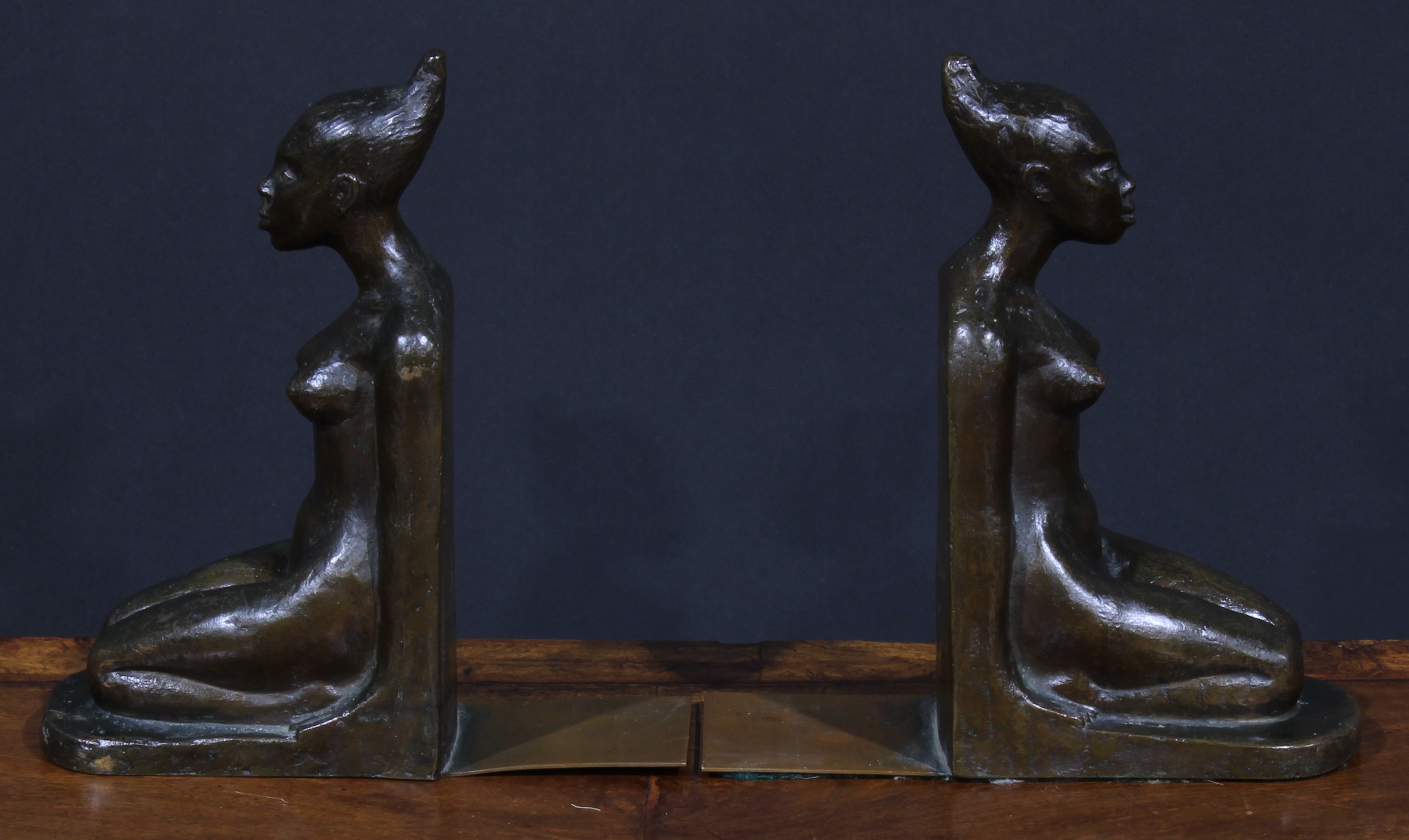 A pair of Art Deco brown patinated bronze bookends, probably Austrian, each cast as a kneeling - Image 4 of 4