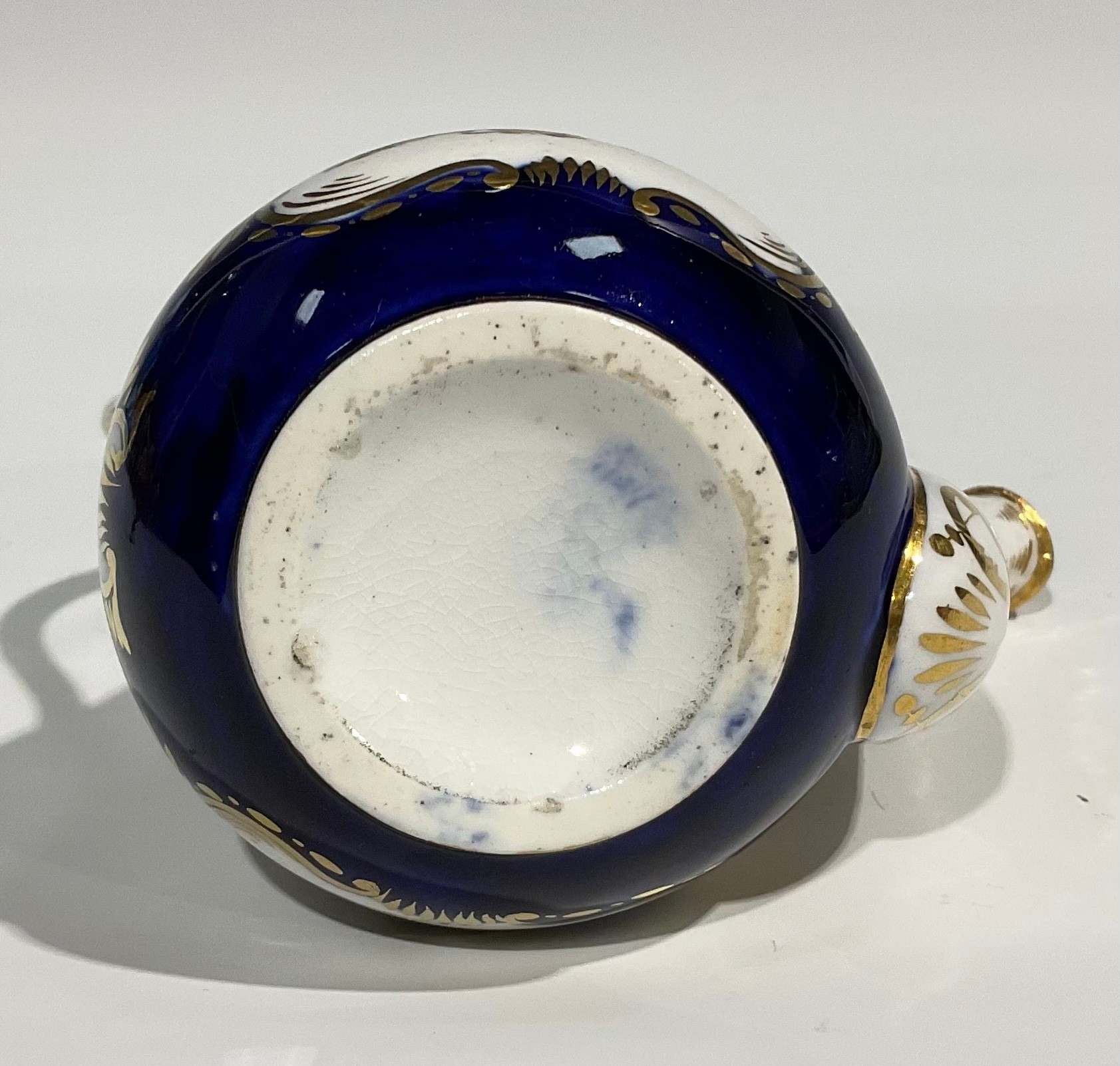 An English porcelain miniature jug and bowl, probably Rockingham, painted with flowers on a green - Image 9 of 12