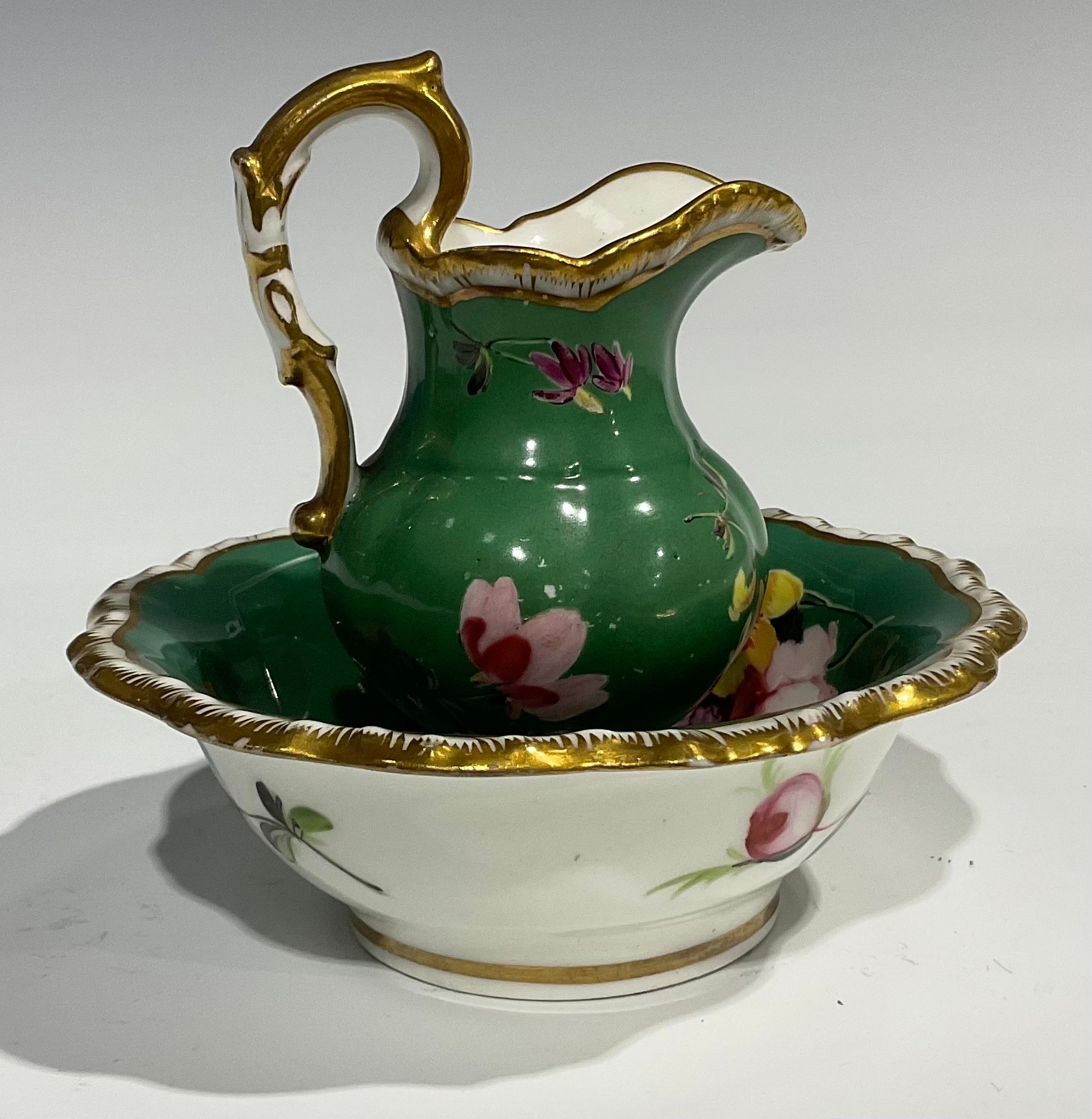 An English porcelain miniature jug and bowl, probably Rockingham, painted with flowers on a green - Image 5 of 12