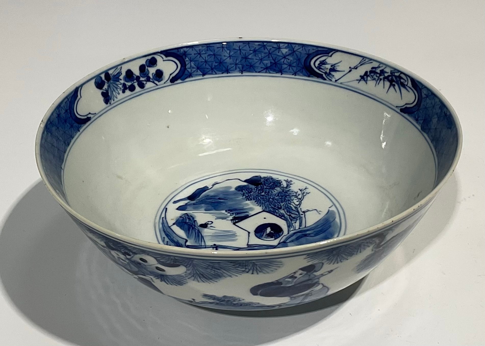 A Chinese circular bowl, playing in tones of underglaze blue with figures in a monumental landscape, - Image 3 of 8