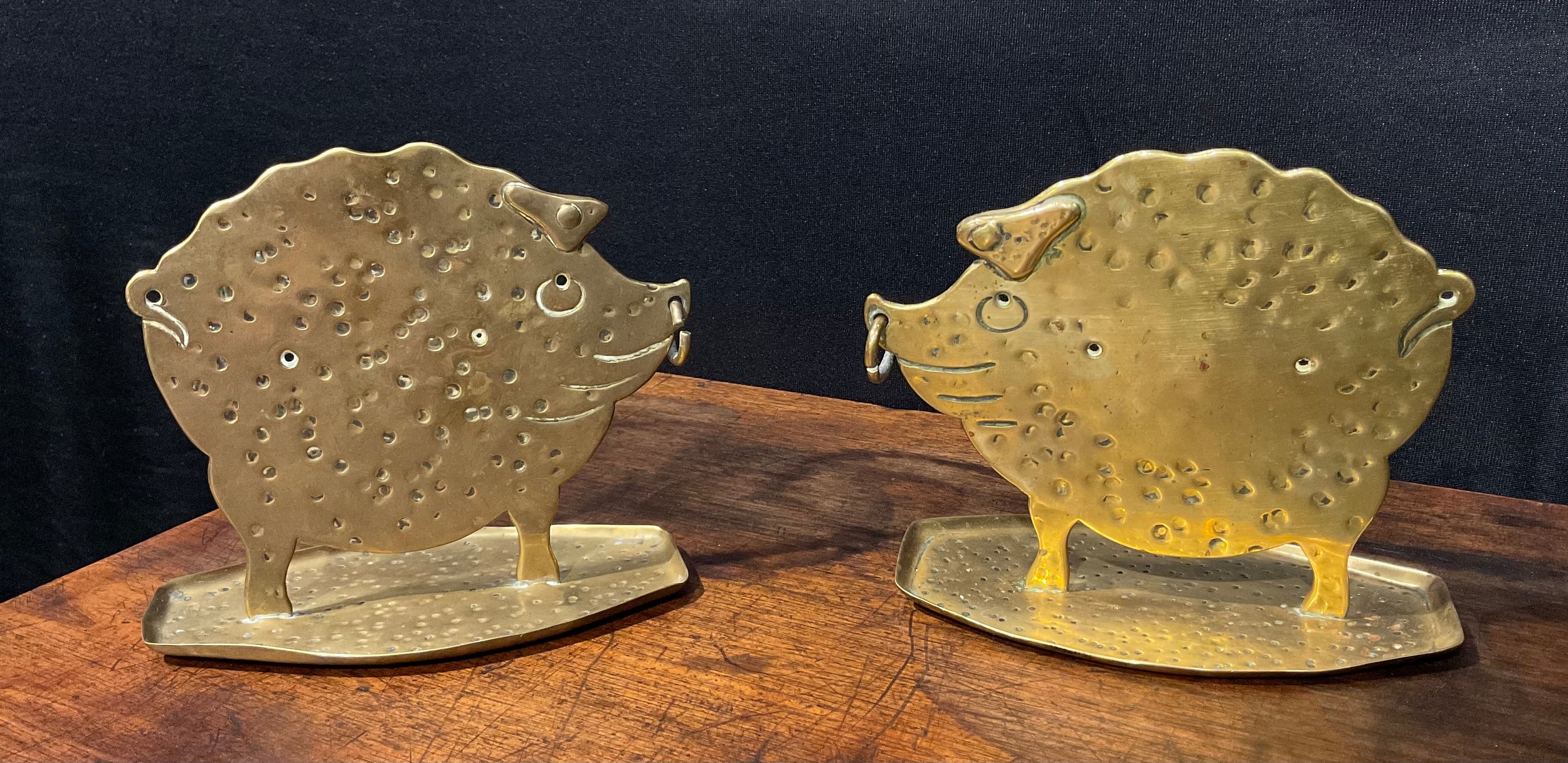 A pair of German Arts and Crafts brass models, of stylised pigs, in silhouette, planished overall, - Image 2 of 5