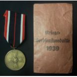 WW2 Third Reich Kriegsverdienstmedaille - War Merit Medal complete with ribbon in original packet of