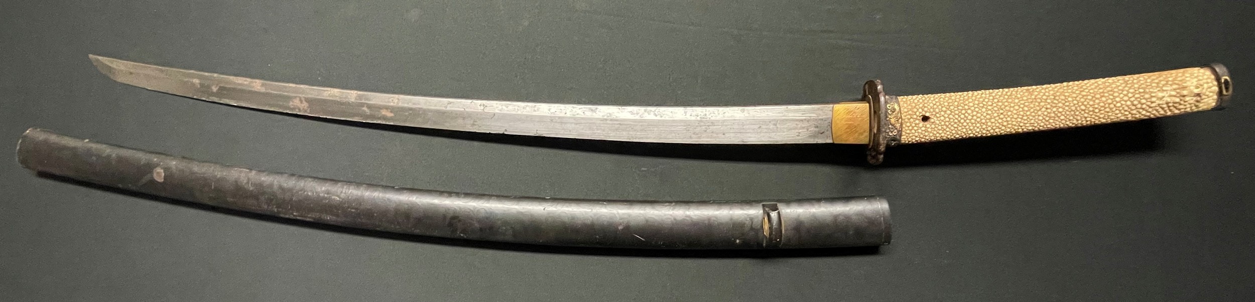 Japanese Katana with single edged blade 640mm in length. Tang is signed. Two holes to tang.