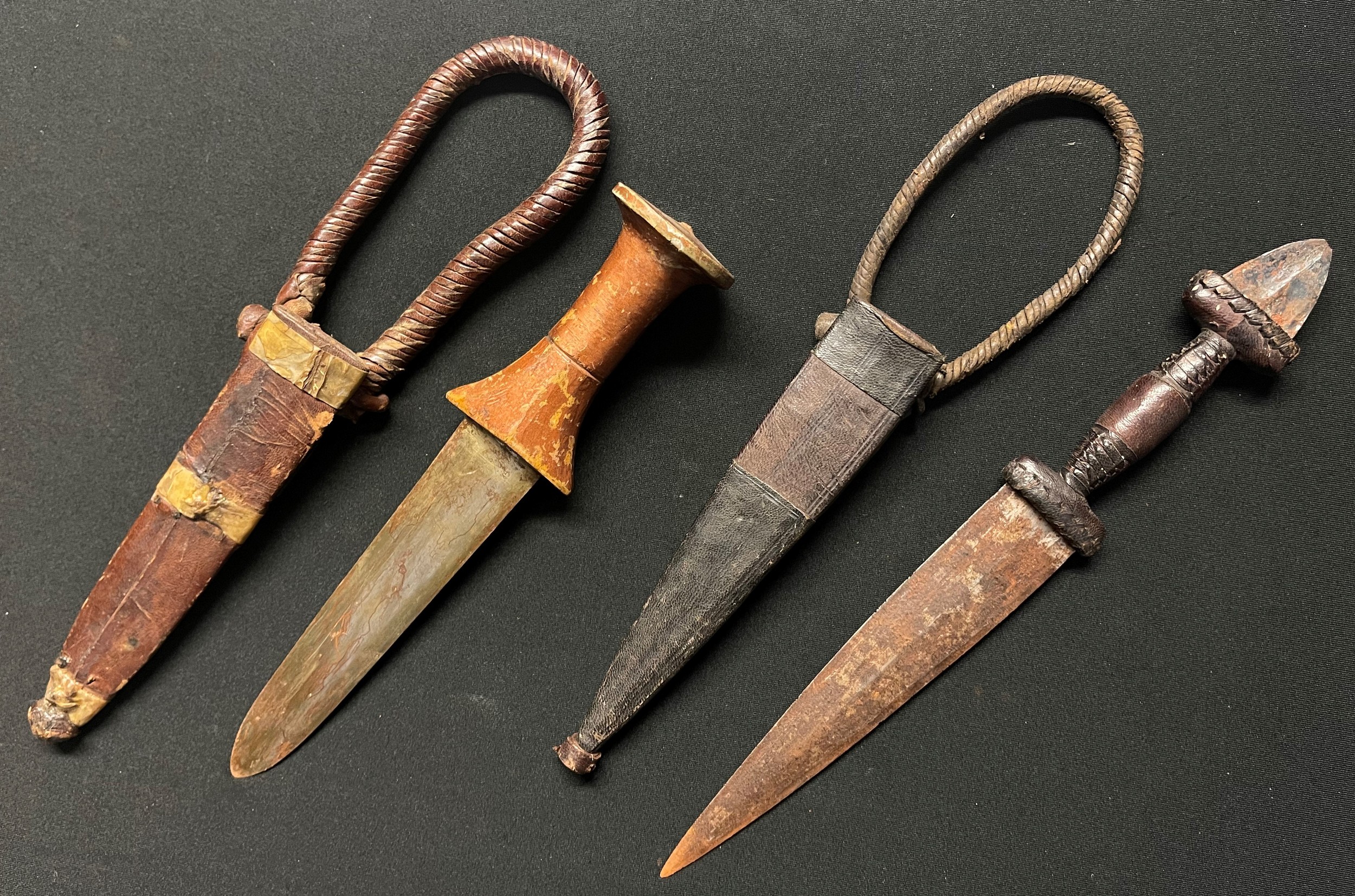 Two African Sleeve Daggers: one with gold painted wooden grip with 134mm long double edged blade, - Image 3 of 3