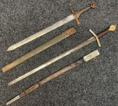 Pair of film prop German Swords in Crusader style: One with double edged blade, blunt round tip,
