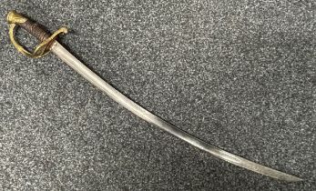 French Sword with curved, fullered, engraved blade 694mm in length. Brass guard. Wooden grip with