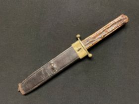 A Bowie knife with single edged blade 180mm in length, maker marked "Joseph Rodgers, Sheffield".