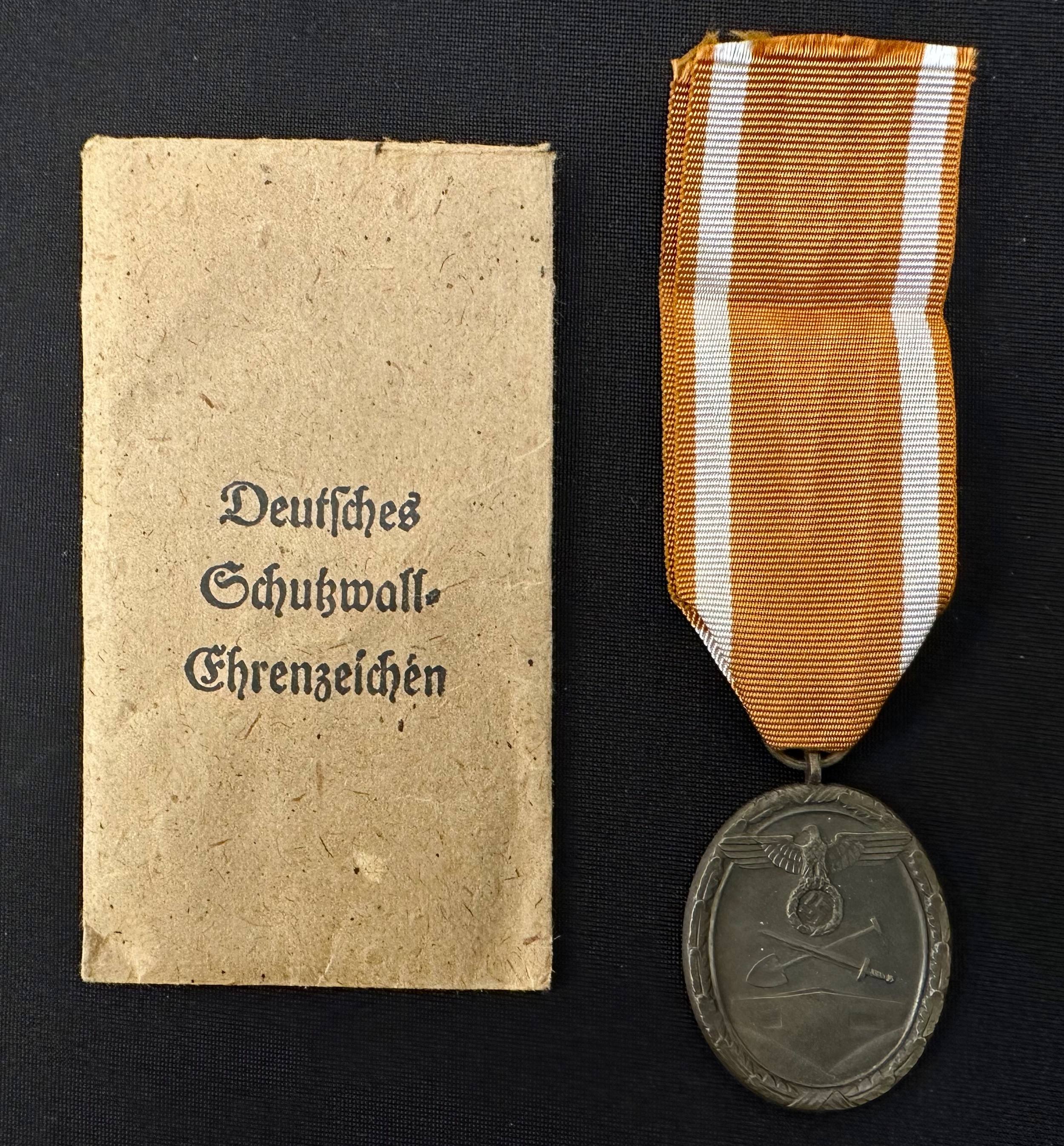 WW2 Third Reich Deutsches Schutzwall-Ehrenzeichen - West Wall Medal. Complete with ribbon and in