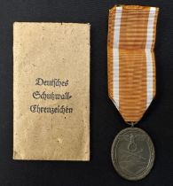 WW2 Third Reich Deutsches Schutzwall-Ehrenzeichen - West Wall Medal. Complete with ribbon and in